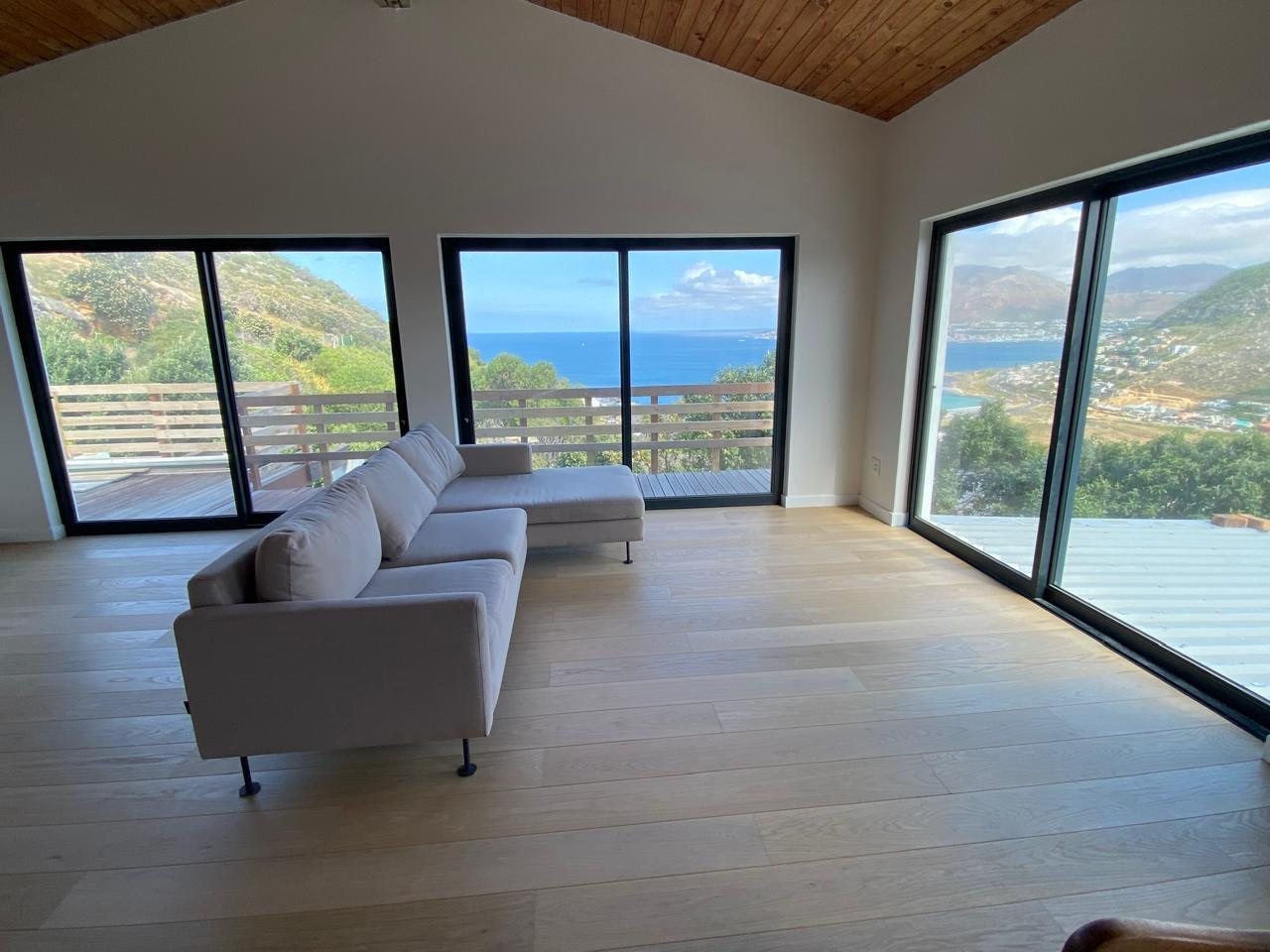Wide engineered oak planks in a coastal Cape Town home with bay views