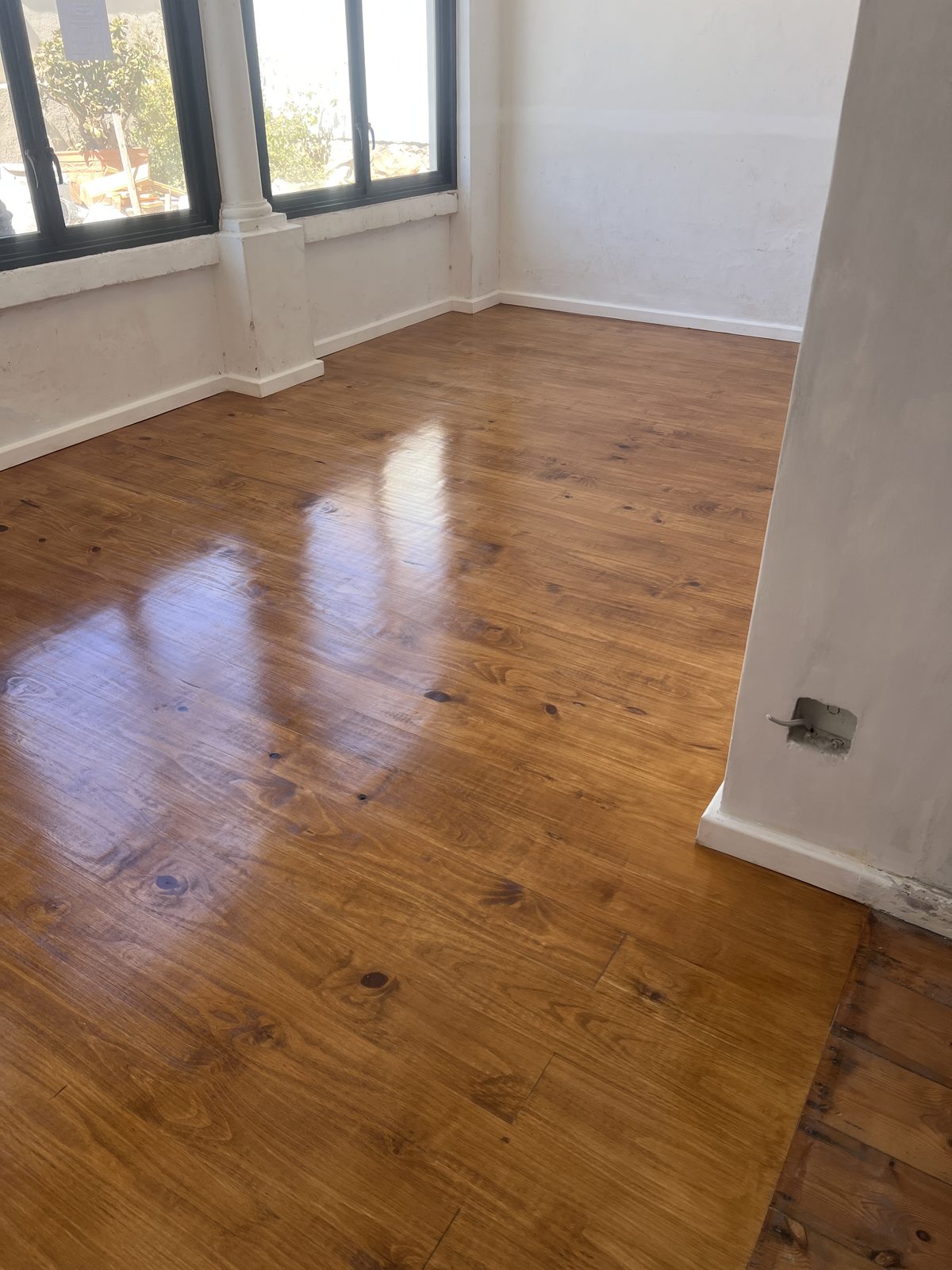 Finished attic pine floor with a warm Oregon stain and polyurethane seal
