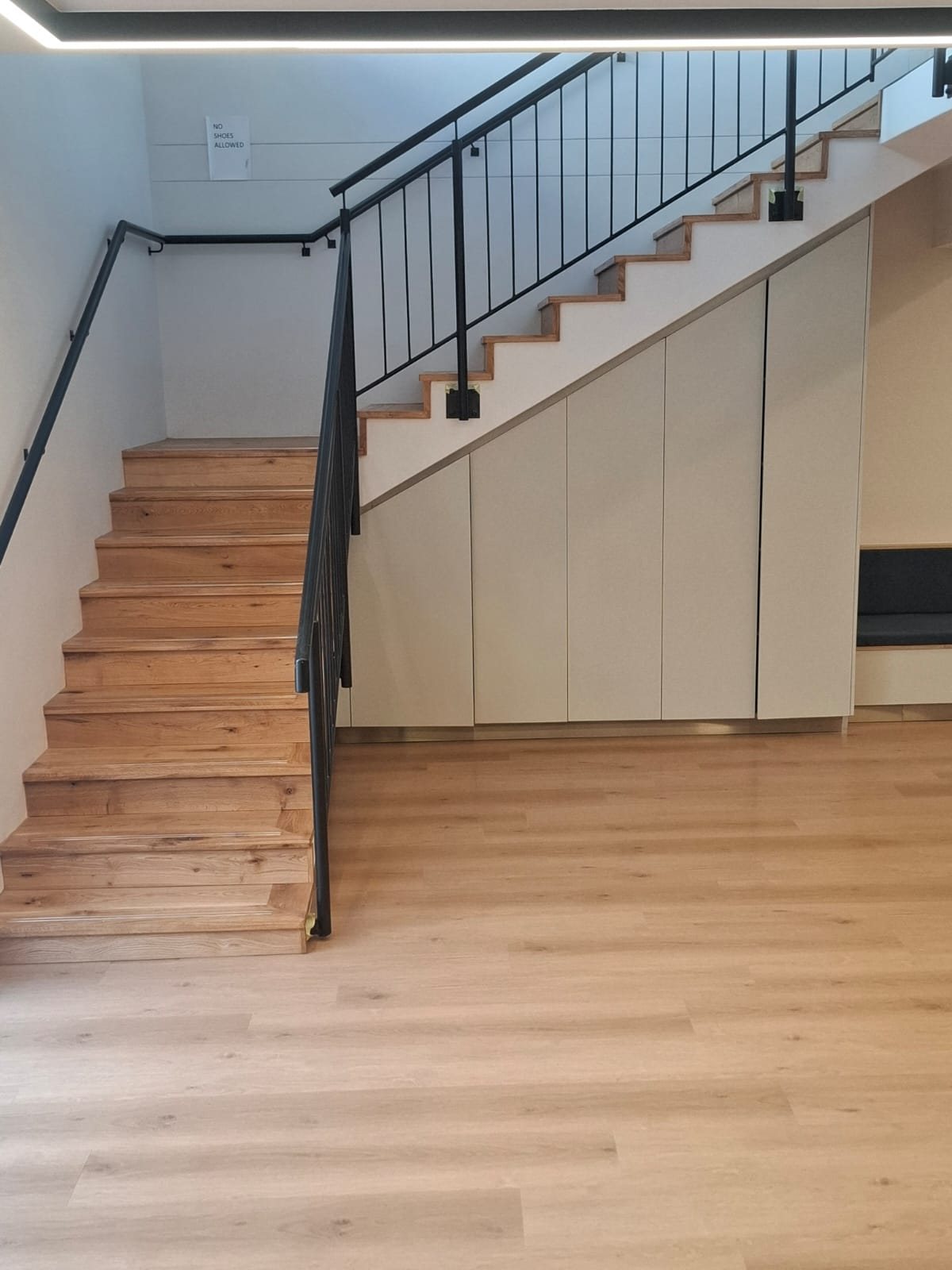 Engineered-oak staircase with custom nosing and slotted aluminium non-slip strips