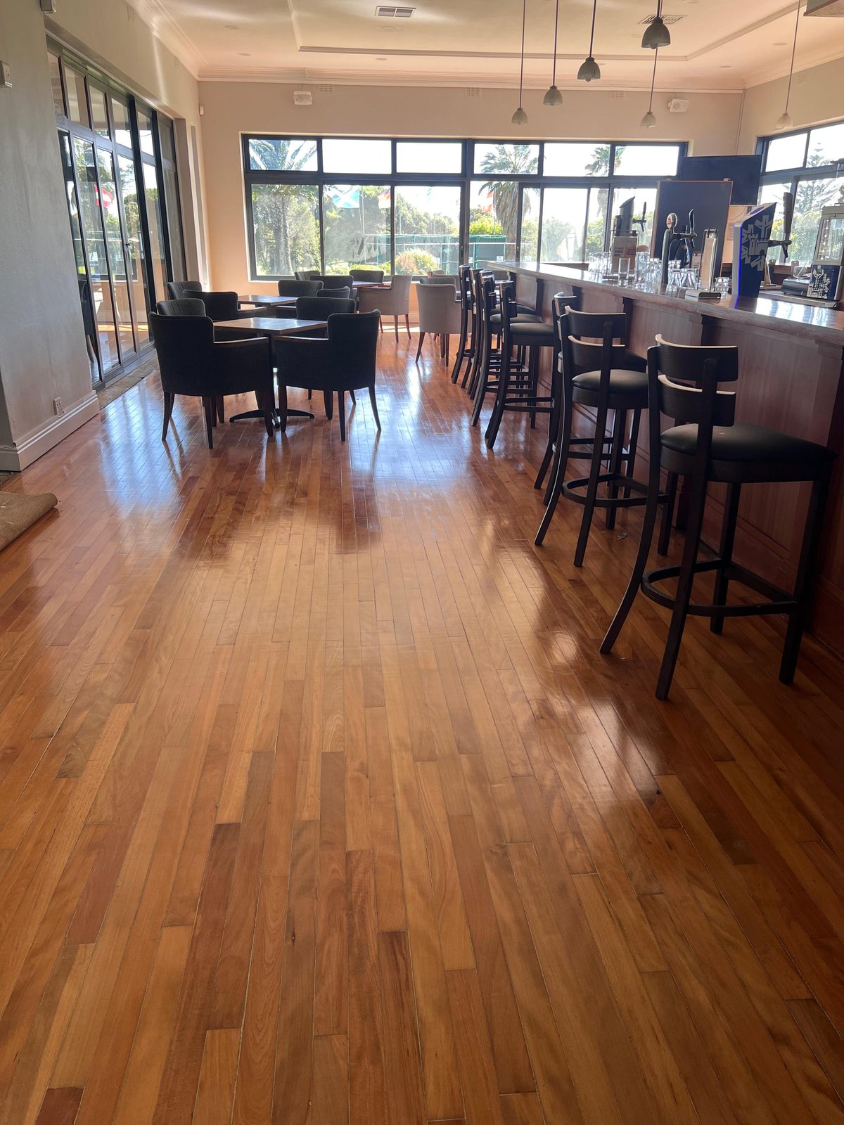 Restored timber floor at Rondebosch Golf Club after sand and seal