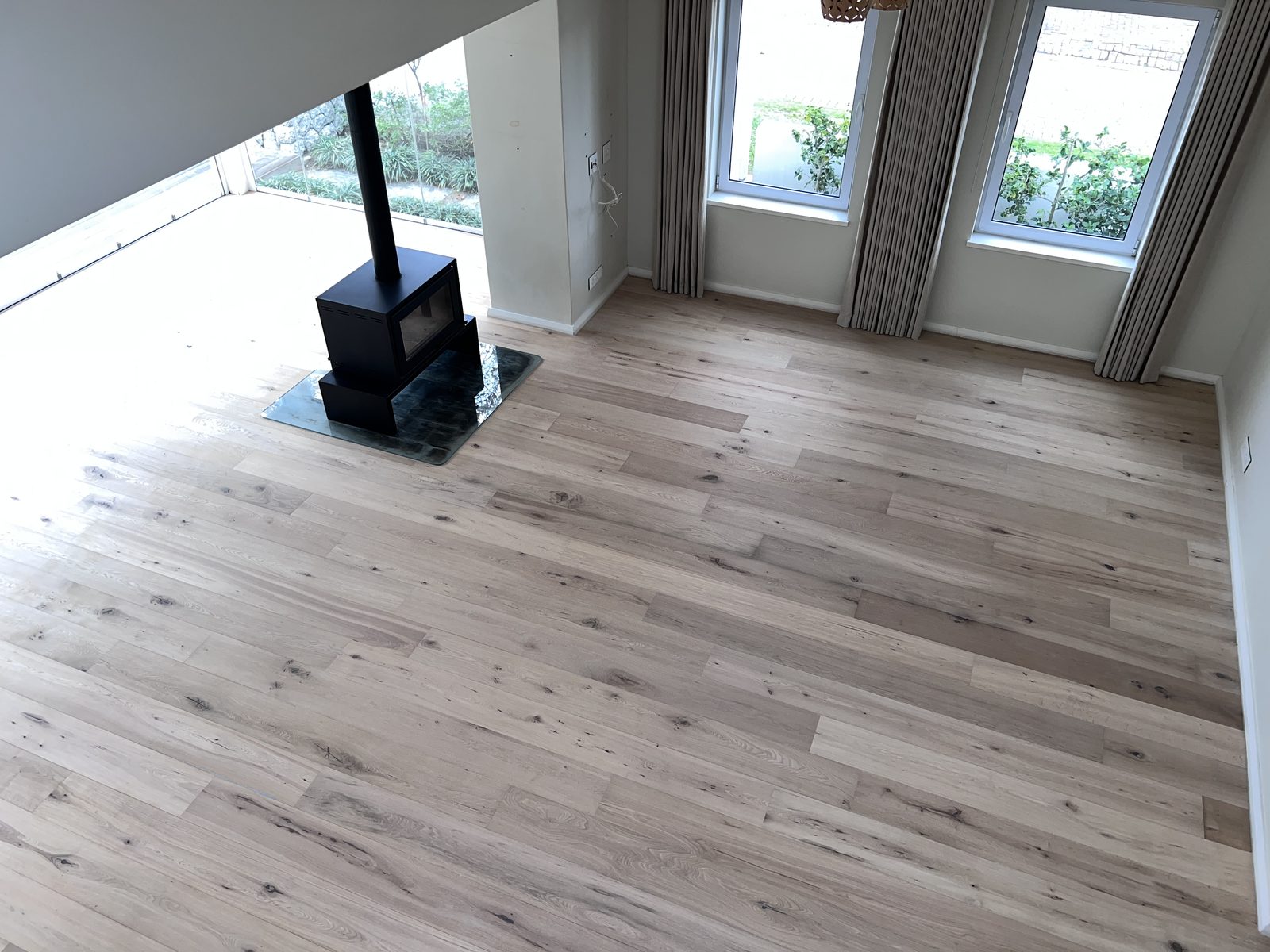 Open-plan living area with freshly sanded and sealed oak flooring